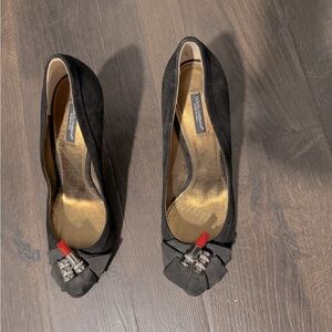 Pre owed Dolce & Gabbana black suede heels in excellent condition.